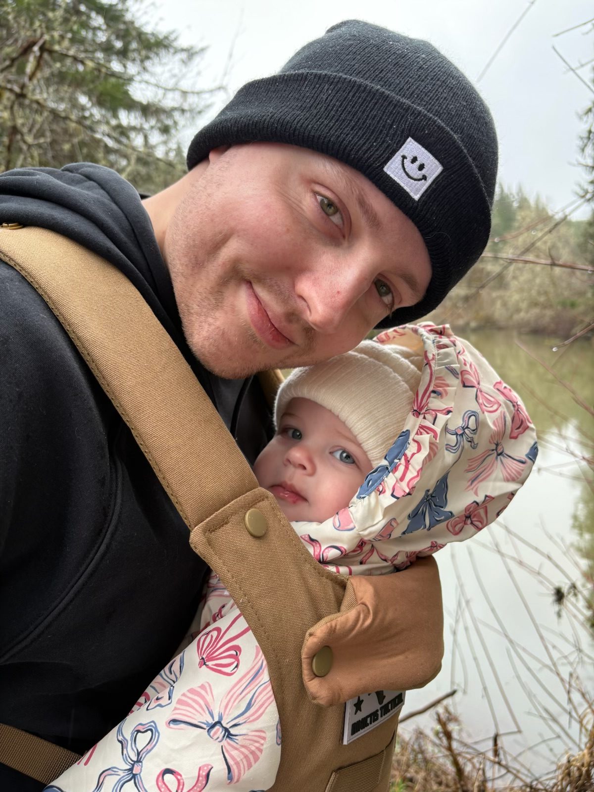 Andrew Allred with his daughter on a trail by the water